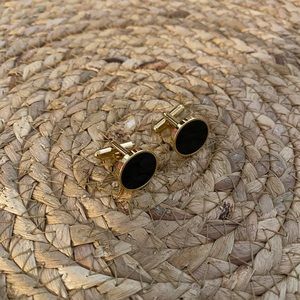 Men’s black and gold cuff links